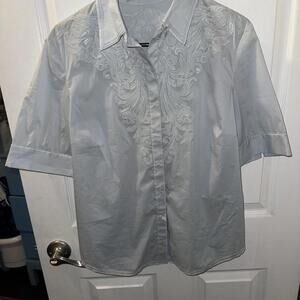 Ellie Tahari light blue, embroidered, hidden snap front.